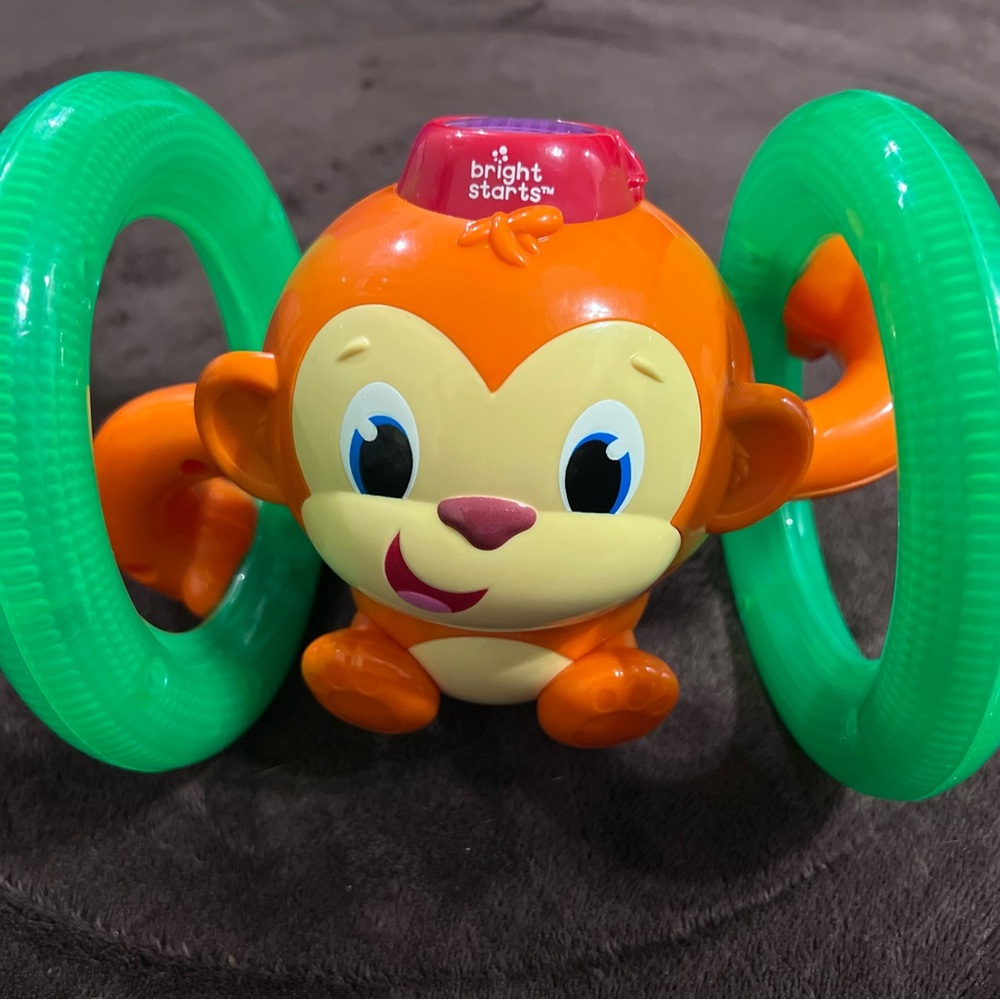 Playful Orange and Green Learning Toy with Rolling Wheels